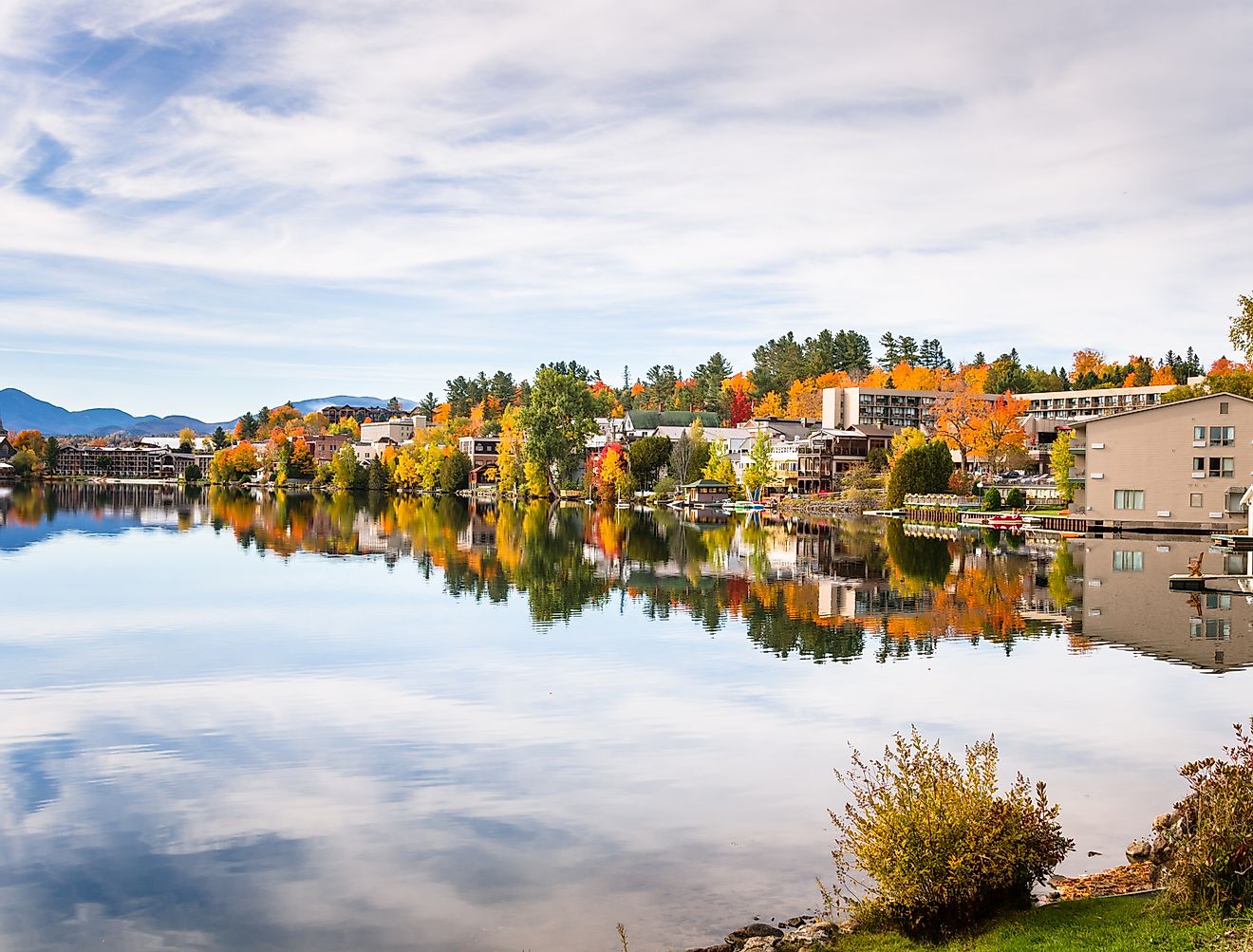 Mountain Village in Autumn and Reflection in Water. Lake Placid, Upstate New York
