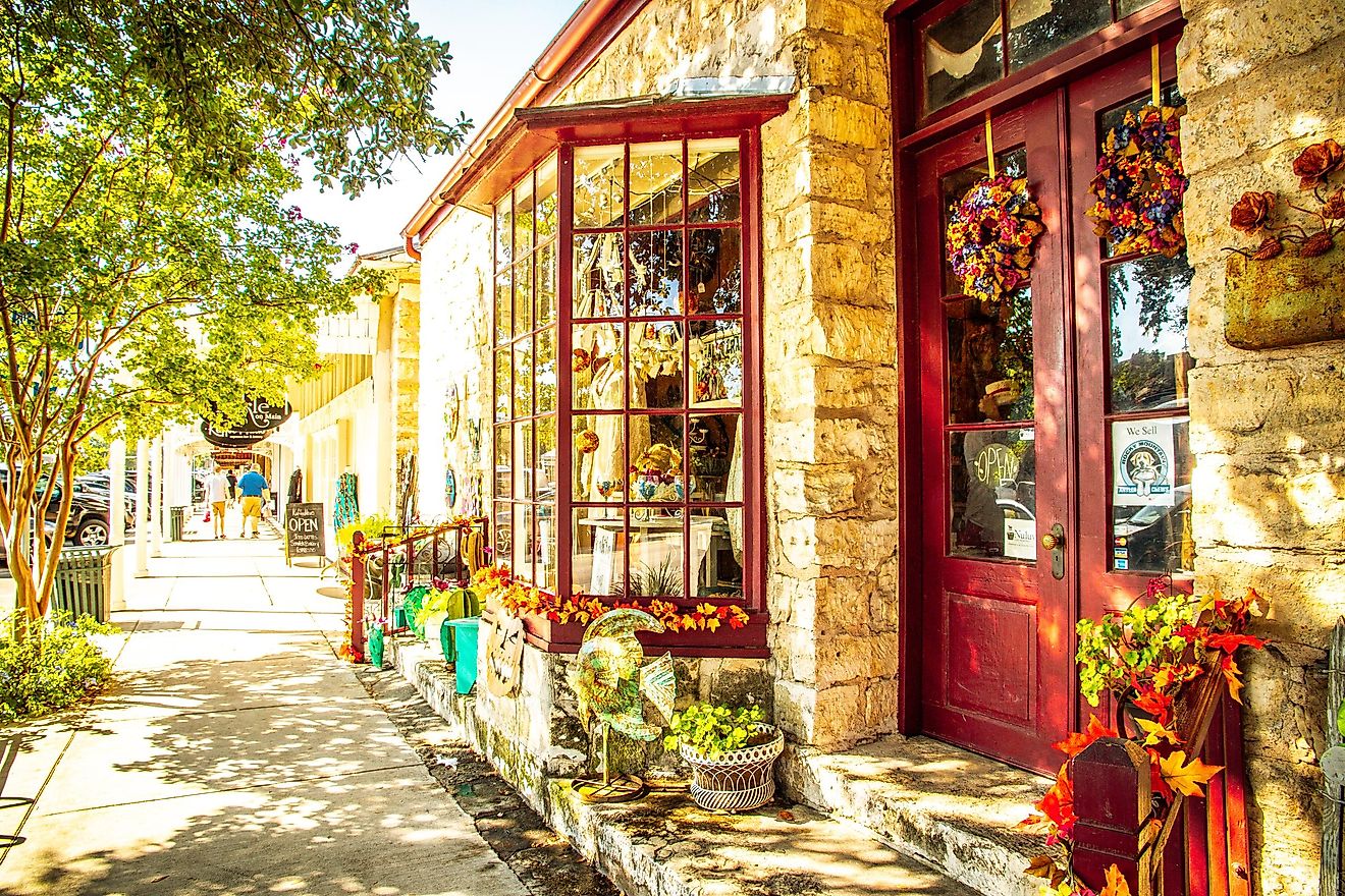 Busy Main Street in Fredericksburg, Texas, lined with retail stores and people strolling, known as 'The Magic Mile.' Editorial credit: ShengYing Lin / Shutterstock.com