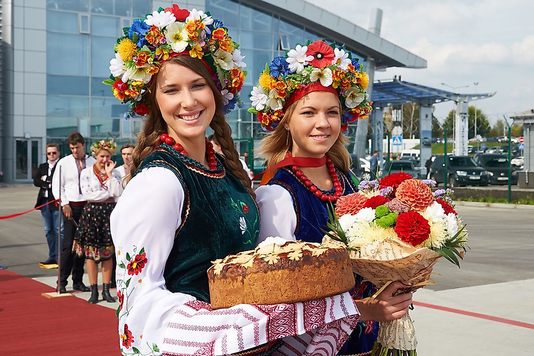 Women dressed in national costumes at the airport in Kiev.Editorial credit: Dmitry Birin / Shutterstock.com.