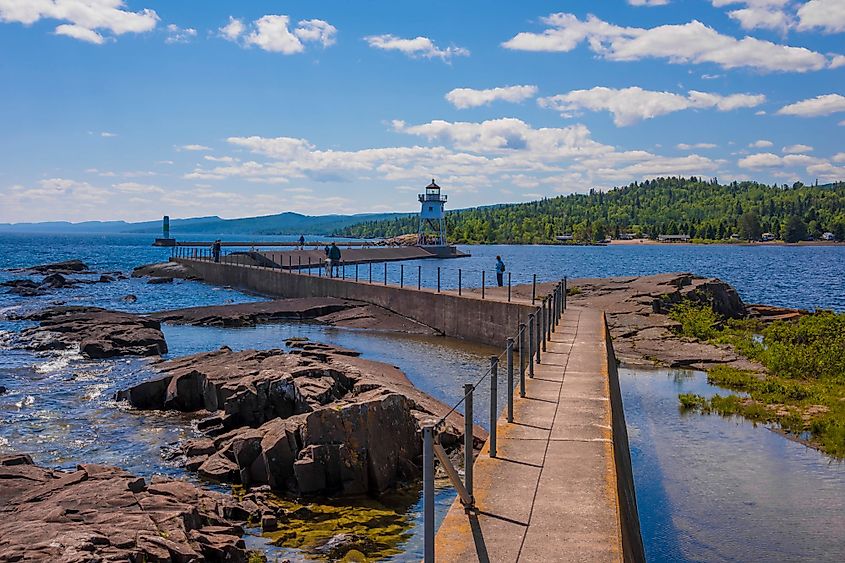 Grand Marais Lighthouse against the backdrop of the Sawtooth Mountains on Lake Superior