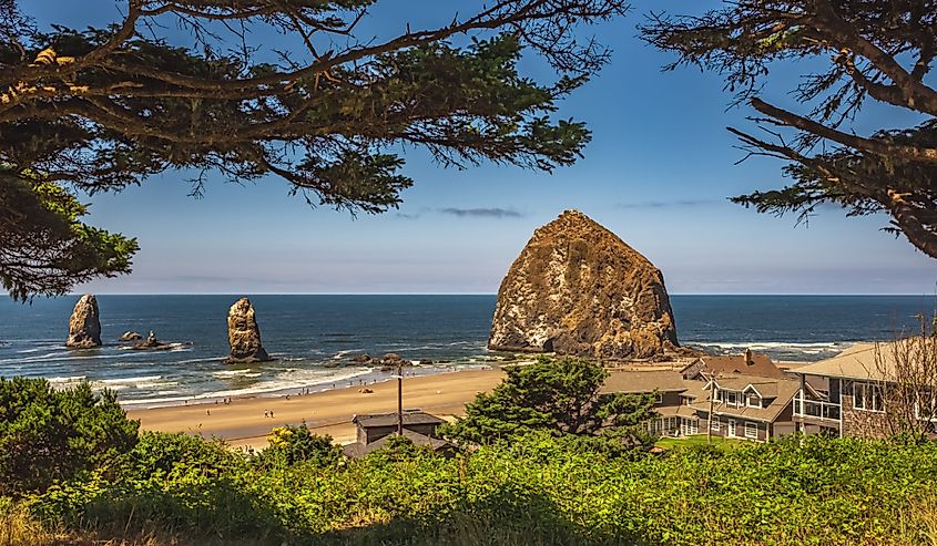 Cannon Beach Landscape, Oregon USA. Cannon Beach with blue sky in the background. Rocks on a shore on a sunny summer day in Oregon Coast