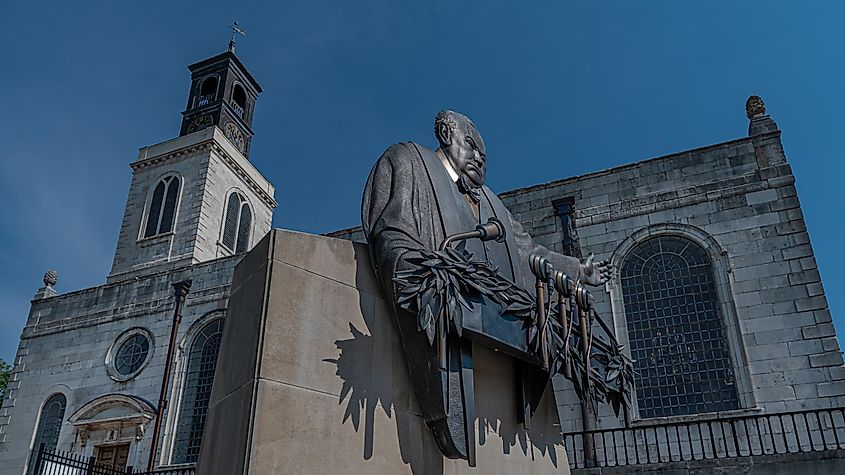 Bronze statue by Don Weigand stands in front of church at Westminster College that serves as National Winston Churchill Museum in Fulton, Missouri. Editorial credit: RozenskiP / Shutterstock.com