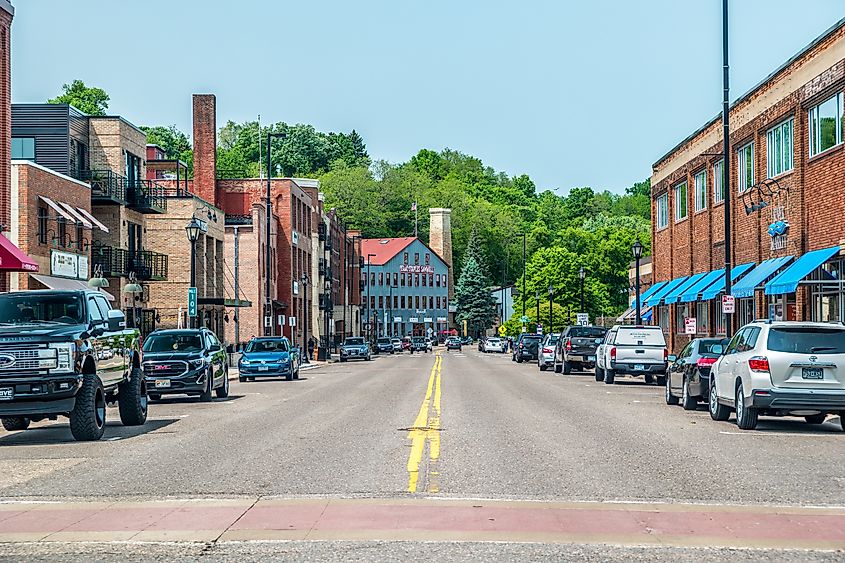 Stillwater, Minnesota, USA. Street view of the downtown stores and restaurants in historic buildings and cars parked alongside on a sunny day in summer. Editorial credit: Sandra Burm / Shutterstock.com