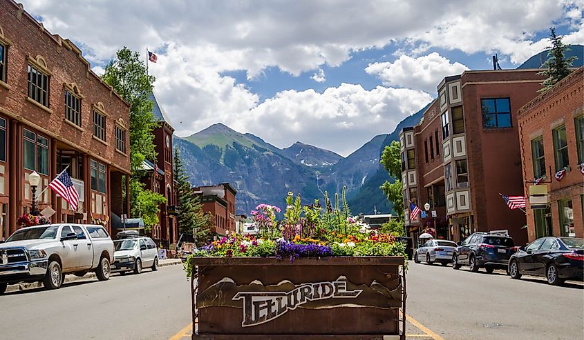 Downtown Telluride, Colorado with buildings and mountains in the background