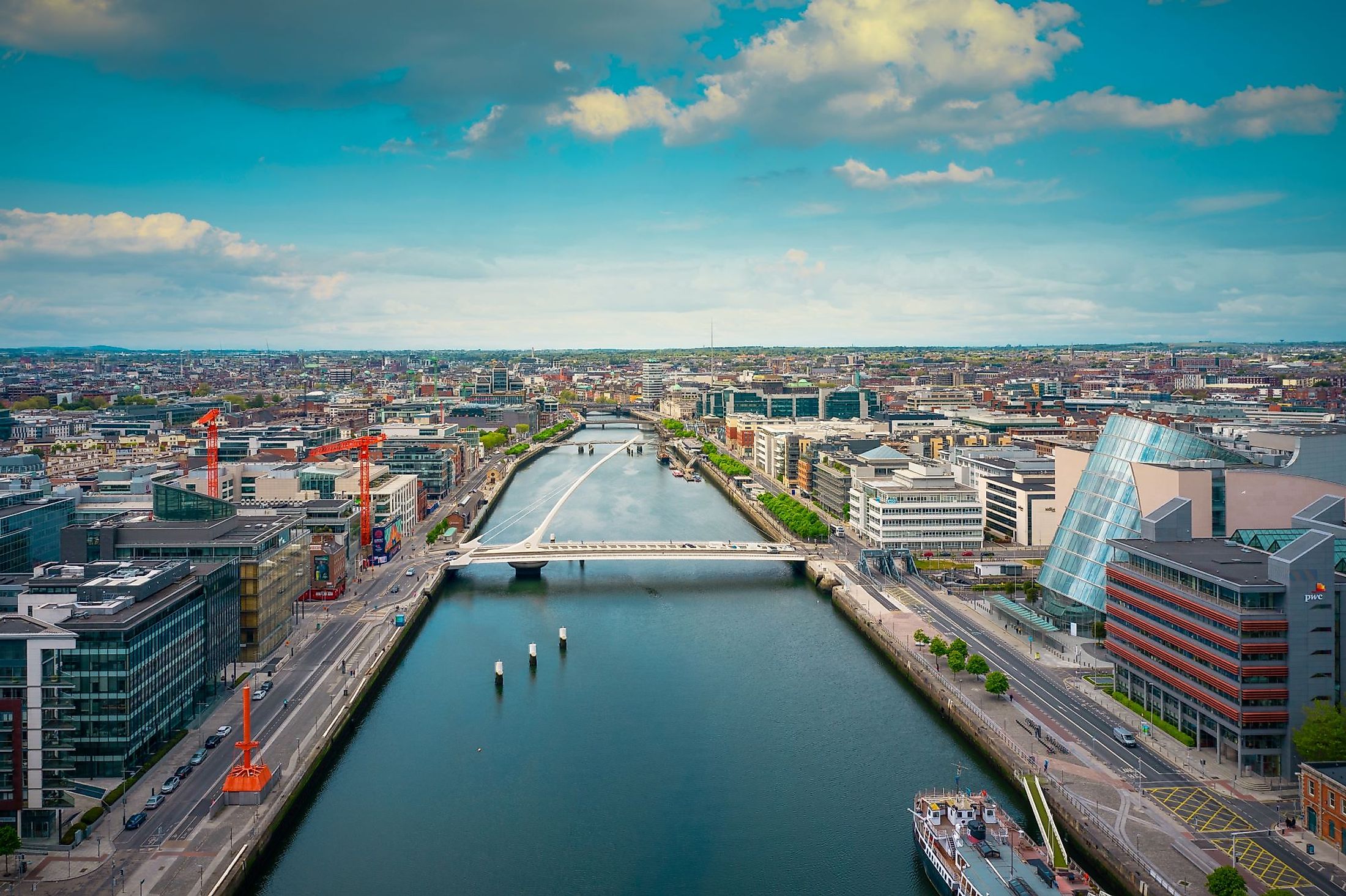 Aerial view of the Dublin city center at sunset with River Liffey and Samuel Beckett Bridge. Editorial credit: 4H4 Photography / Shutterstock.com
